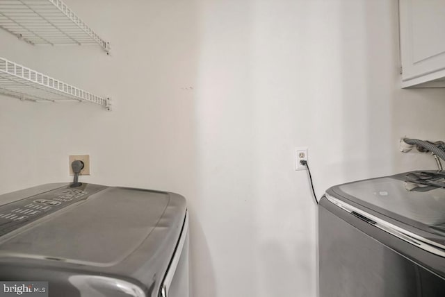 8549 Blue Rock Ln, Lorton, VA 22079 - washroom with cabinet space and washer and dryer