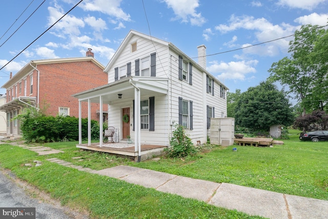 332 Old Stone House Rd S, Boiling Springs, PA 17007 - view of front facade with a chimney, a front yard, and a porch