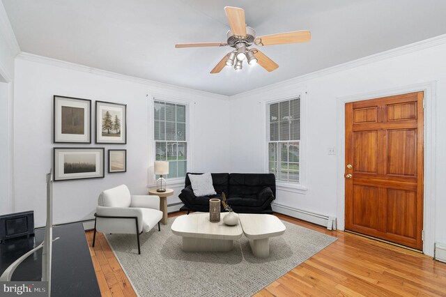 332 Old Stone House Rd S, Boiling Springs, PA 17007 - living area with baseboard heating, crown molding, light wood finished floors, and a ceiling fan