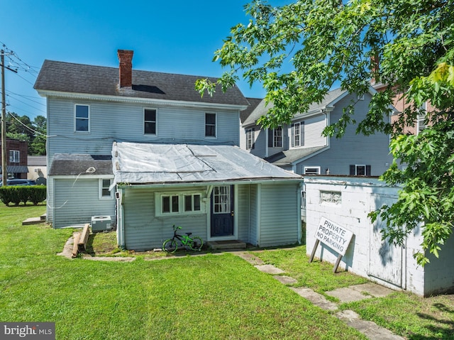 396 Cypress St, Millington, MD 21651 - rear view of house featuring entry steps, a chimney, and a lawn