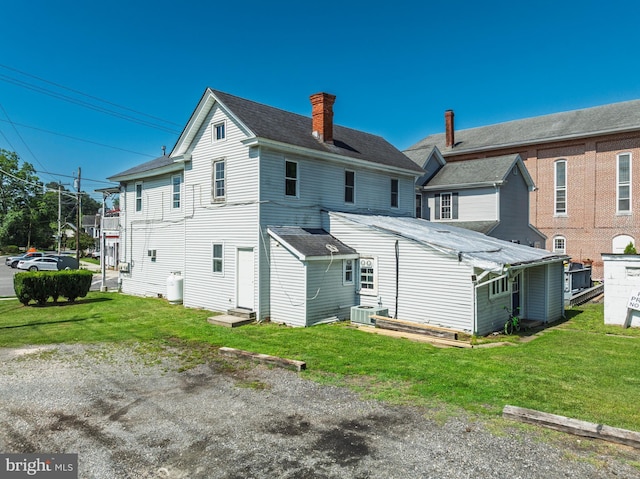 396 Cypress St, Millington, MD 21651 - back of property featuring a chimney, entry steps, and a yard
