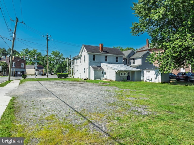 396 Cypress St, Millington, MD 21651 - rear view of property with a yard and driveway