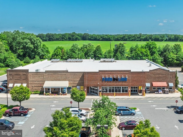 396 Cypress St, Millington, MD 21651 - view of commercial location with uncovered parking and view of wooded area