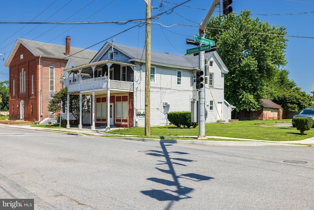 396 Cypress St, Millington, MD 21651 - view of front of property with a balcony and a front yard