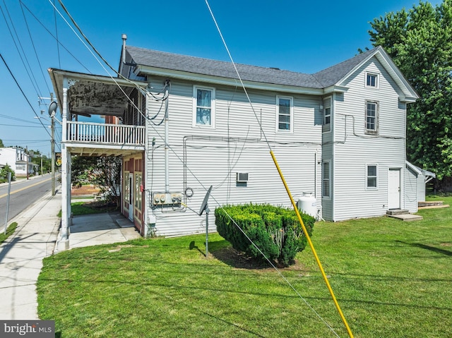 396 Cypress St, Millington, MD 21651 - view of side of property featuring a balcony, roof with shingles, and a lawn
