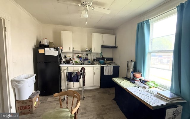 396 Cypress St, Millington, MD 21651 - kitchen featuring black appliances, wood finished floors, white cabinets, crown molding, and ceiling fan
