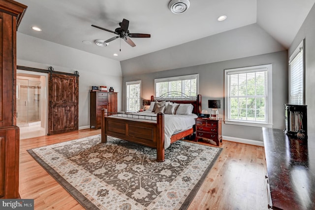 606 E Seminary Ave, Baltimore, MD 21286 - bedroom featuring lofted ceiling, light wood finished floors, a barn door, recessed lighting, and a ceiling fan