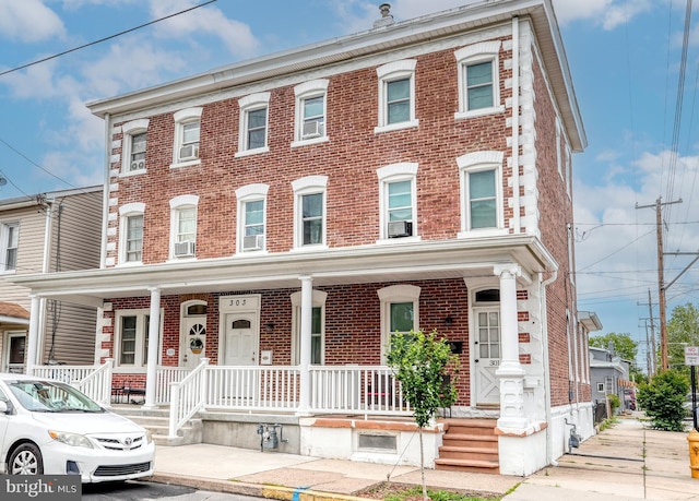 303 Lincoln Ave, Bristol, PA 19007 - view of property with brick siding and covered porch