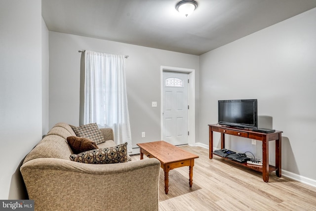 303 Lincoln Ave, Bristol, PA 19007 - living room featuring light wood-type flooring and baseboard heating