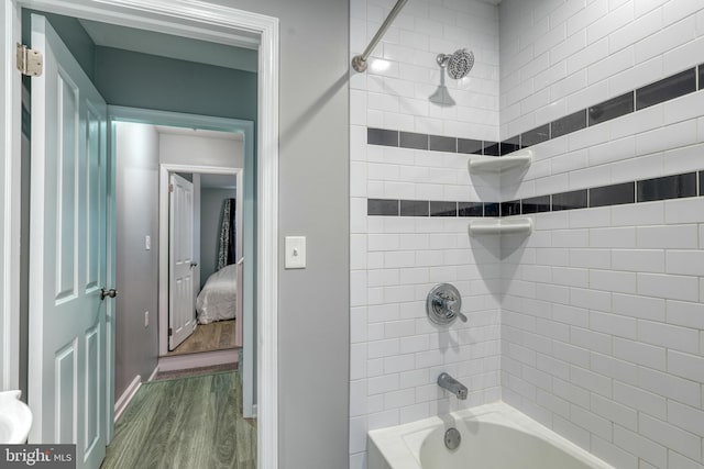 303 Lincoln Ave, Bristol, PA 19007 - ensuite bathroom featuring wood finished floors and bathtub / shower combination