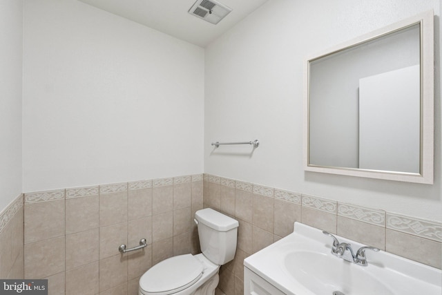 1544 Ingram Ter, Silver Spring, MD 20906 - half bath featuring tile walls, wainscoting, and vanity