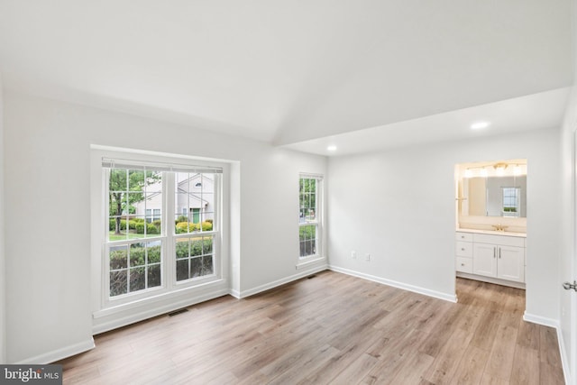 1544 Ingram Ter, Silver Spring, MD 20906 - spare room with healthy amount of natural light, light wood finished floors, recessed lighting, and lofted ceiling