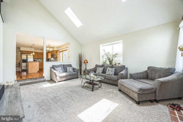 6 Spring Mill Ct, Sewell, NJ 08080 - living area with a chandelier, healthy amount of natural light, high vaulted ceiling, a skylight, and carpet