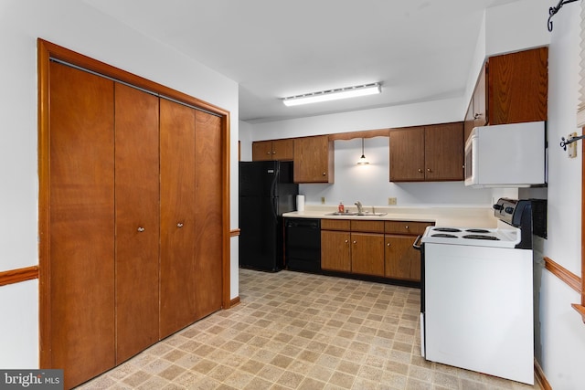 10624 Millbrook Dr, Chestertown, MD 21620 - kitchen featuring black appliances, light countertops, light floors, and brown cabinetry