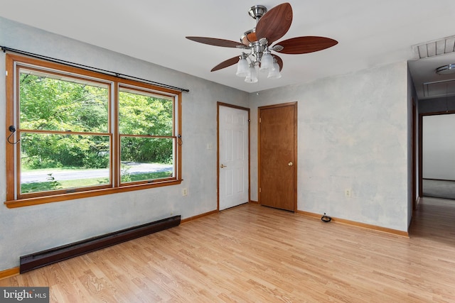 10624 Millbrook Dr, Chestertown, MD 21620 - unfurnished room with baseboard heating, light wood-style floors, a ceiling fan, and attic access