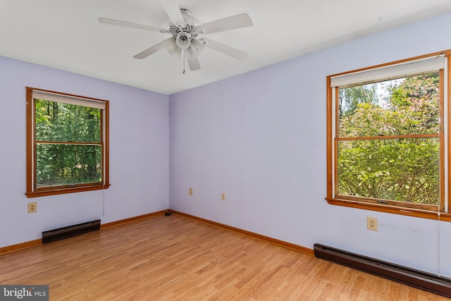 10624 Millbrook Dr, Chestertown, MD 21620 - spare room with a baseboard radiator, healthy amount of natural light, light wood-type flooring, and ceiling fan