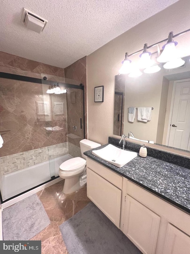 1517 Lincoln Way Unit 204, Mclean, VA 22102 - bathroom featuring a textured ceiling, vanity, and a stall shower