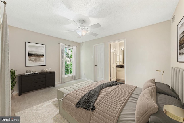 1517 Lincoln Way Unit 204, Mclean, VA 22102 - bedroom with light colored carpet, a textured ceiling, ensuite bathroom, and a ceiling fan