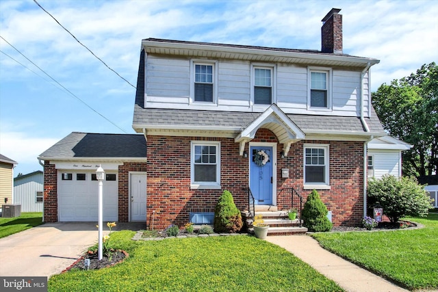 105 Allegheny Ave, Hanover, PA 17331 - view of front facade featuring brick siding, a chimney, concrete driveway, a front lawn, and an attached garage