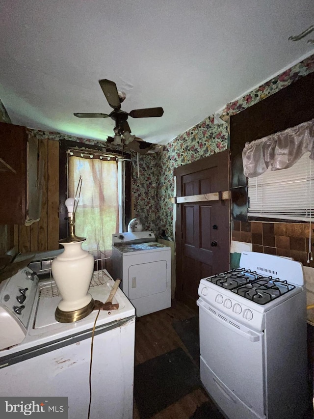 2524 Mchenry St, Baltimore, MD 21223 - kitchen with white gas range oven, ceiling fan, wallpapered walls, plenty of natural light, and dark wood-style flooring