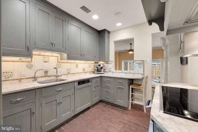 624 S Pitt St Unit 1/2, Alexandria, VA 22314 - kitchen featuring gray cabinets, brick flooring, dishwasher, tasteful backsplash, and ceiling fan