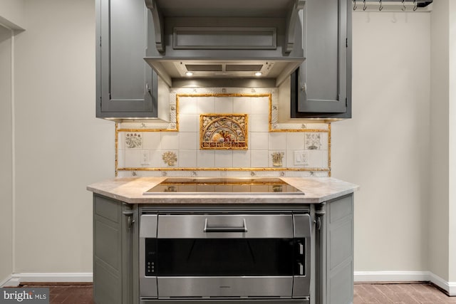 624 S Pitt St Unit 1/2, Alexandria, VA 22314 - kitchen with wall oven, black electric stovetop, gray cabinetry, decorative backsplash, and light countertops