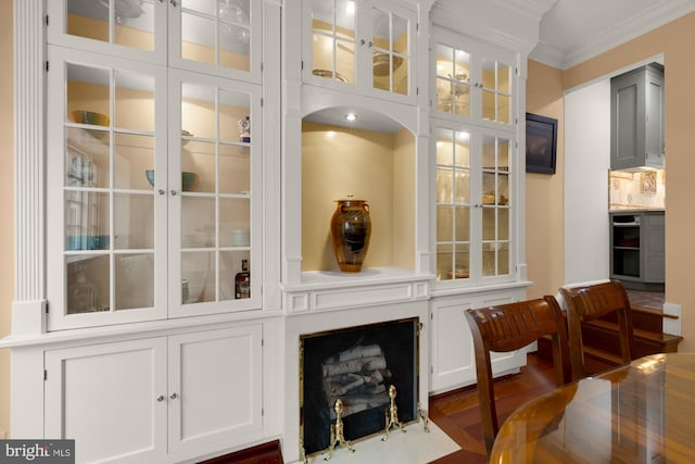 624 S Pitt St Unit 1/2, Alexandria, VA 22314 - dining room with crown molding and dark wood-style flooring
