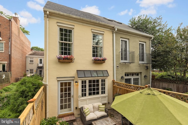 624 S Pitt St Unit 1/2, Alexandria, VA 22314 - back of property featuring stucco siding, a balcony, and a shingled roof