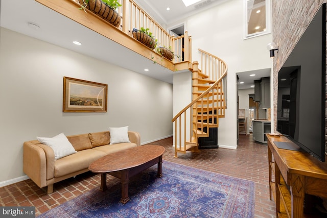 624 S Pitt St Unit 1/2, Alexandria, VA 22314 - living area with brick floors, a high ceiling, stairway, and recessed lighting
