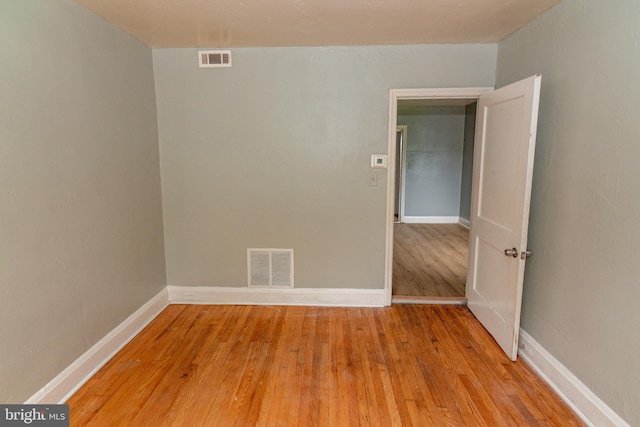3116 Presstman St, Baltimore, MD 21216 - spare room featuring light wood-style floors and baseboards
