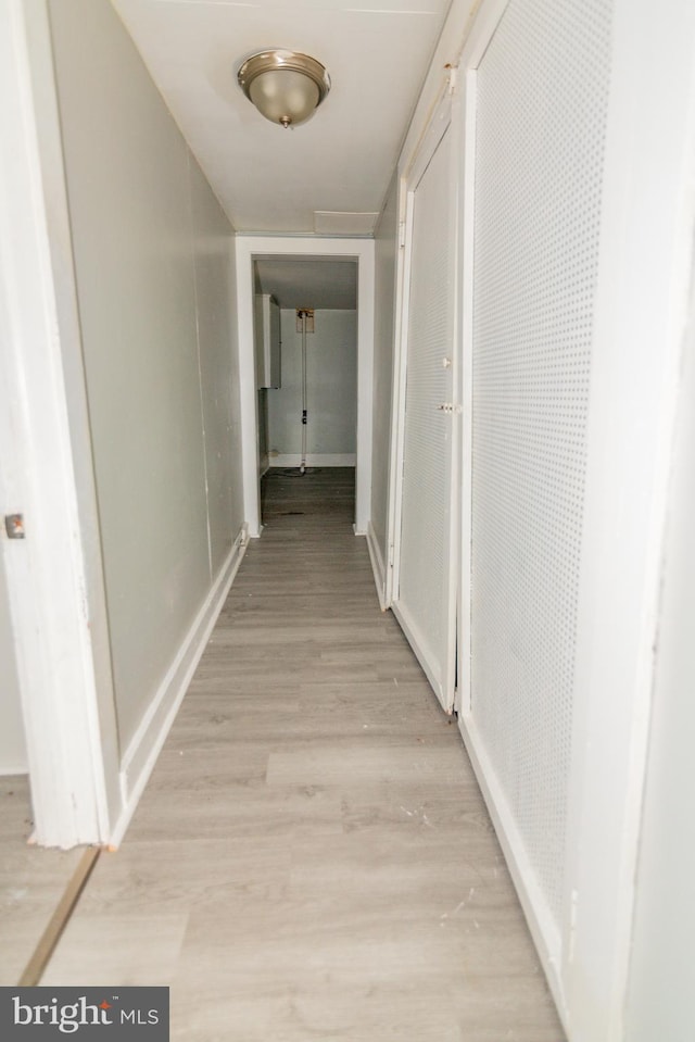 3116 Presstman St, Baltimore, MD 21216 - hall with light wood-style flooring and baseboards