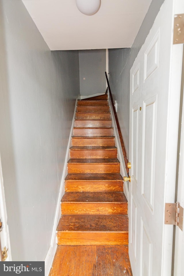 3116 Presstman St, Baltimore, MD 21216 - stairway featuring hardwood / wood-style flooring
