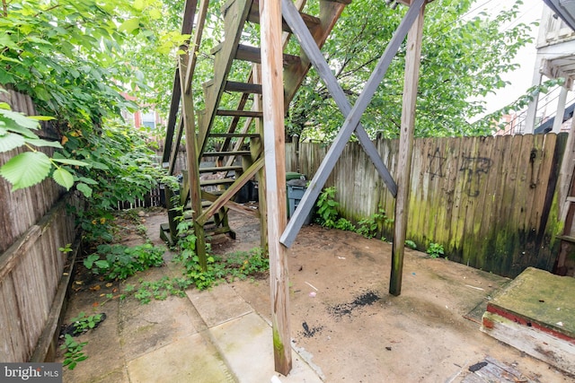 3116 Presstman St, Baltimore, MD 21216 - fenced backyard with stairway and a patio area