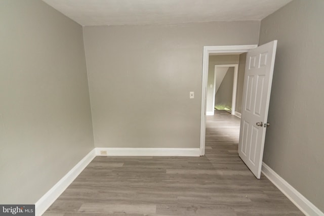 3116 Presstman St, Baltimore, MD 21216 - spare room featuring wood finished floors and baseboards