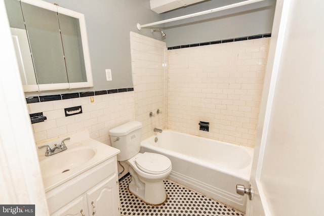 3116 Presstman St, Baltimore, MD 21216 - full bath featuring shower / washtub combination, vanity, tile walls, and wainscoting