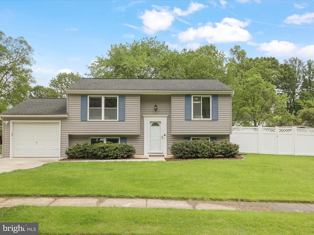 7313 Husky Ln, Springfield, VA 22151 - raised ranch featuring an attached garage and concrete driveway
