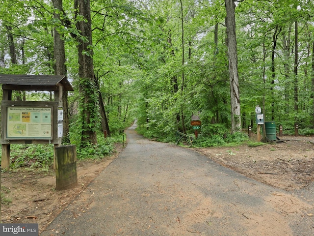 7313 Husky Ln, Springfield, VA 22151 - surrounding community with asphalt driveway and a view of trees