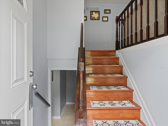 7313 Husky Ln, Springfield, VA 22151 - stairway featuring tile patterned flooring and baseboards
