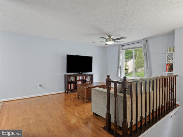 7313 Husky Ln, Springfield, VA 22151 - living area featuring ceiling fan, a textured ceiling, and wood finished floors