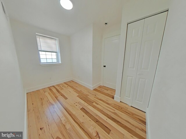 2230 N Mutter St, Philadelphia, PA 19133 - unfurnished bedroom with wood-type flooring and a closet