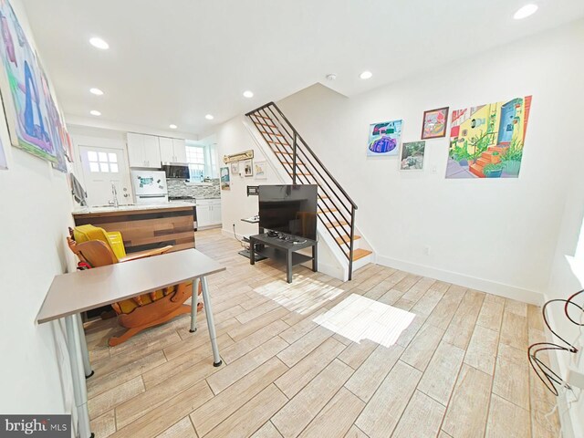 2230 N Mutter St, Philadelphia, PA 19133 - living area featuring stairs, light wood-style floors, and recessed lighting