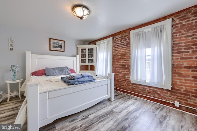 48 Ranck Ave, Lancaster, PA 17602 - bedroom with wood finished floors and brick wall