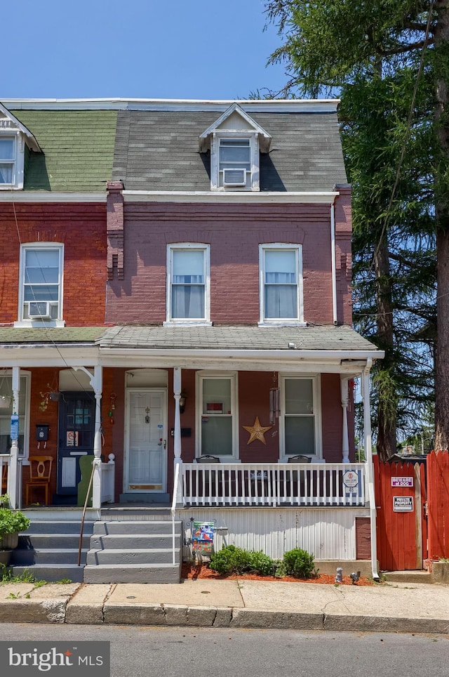 48 Ranck Ave, Lancaster, PA 17602 - townhome / multi-family property featuring a porch, brick siding, and cooling unit