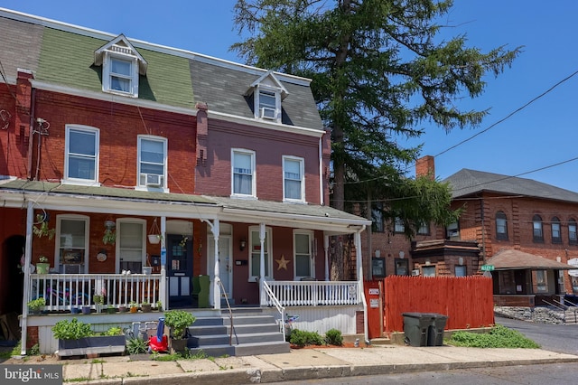 48 Ranck Ave, Lancaster, PA 17602 - multi unit property with covered porch, mansard roof, brick siding, and roof with shingles