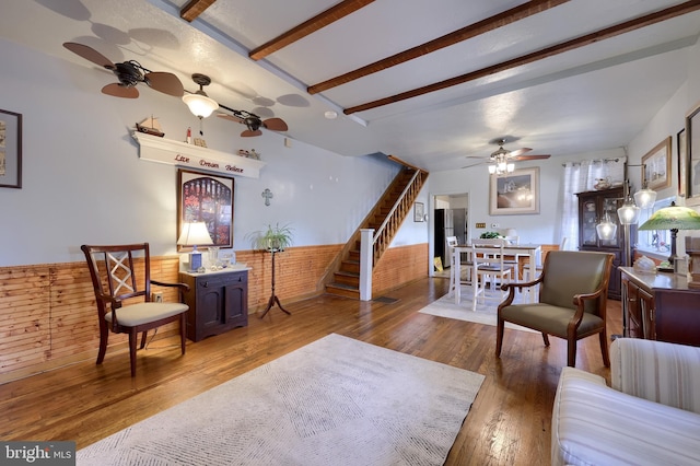 48 Ranck Ave, Lancaster, PA 17602 - living area featuring a ceiling fan, stairs, wood finished floors, and wainscoting
