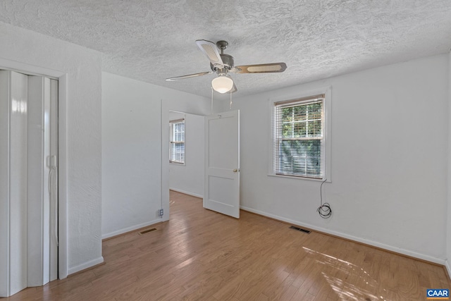 1562 Thomas Jefferson Pkwy, Charlottesville, VA 22901 - spare room featuring ceiling fan, wood finished floors, and a textured ceiling