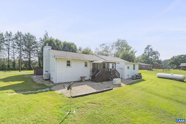 1562 Thomas Jefferson Pkwy, Charlottesville, VA 22901 - back of house with a yard and a chimney