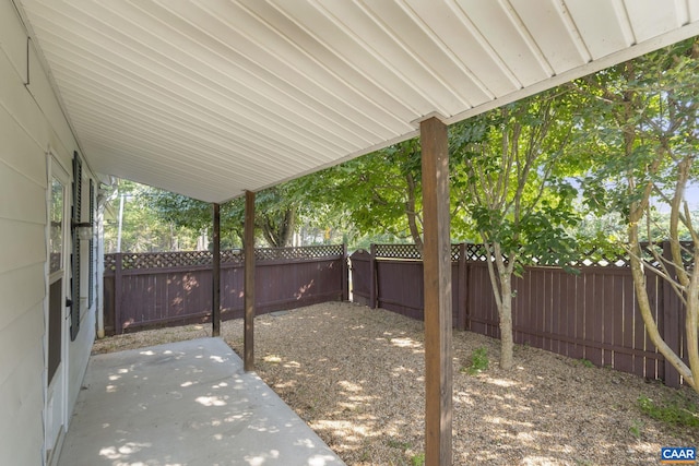1562 Thomas Jefferson Pkwy, Charlottesville, VA 22901 - fenced backyard with a patio area