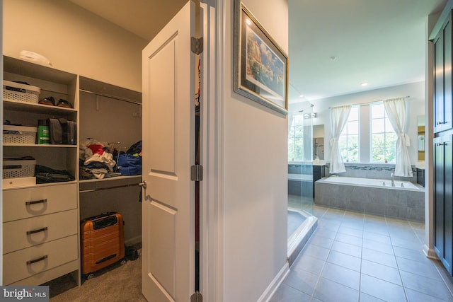 5745 Hawk Ridge Rd, Frederick, MD 21704 - bathroom featuring a garden tub and tile patterned flooring