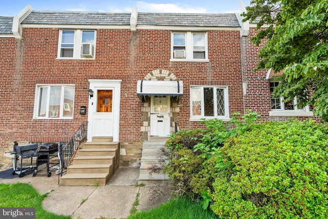6344 Glenloch St, Philadelphia, PA 19135 - view of property featuring a high end roof, brick siding, and mansard roof